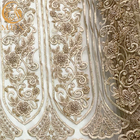Σύγχρονη χρυσή βαριά διακοσμημένη με χάντρες κεντητική υφάσματος δαντελλών για το νυφικό φόρεμα