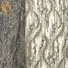Διακοσμημένο με χάντρες ειδικό σχέδιο υφάσματος δαντελλών κεντητικής χειροποίητο για το γαμήλιο φόρεμα
